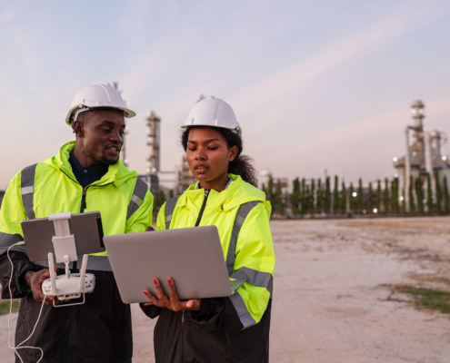 Engineer Specialists Pilot Drone on Construction Site