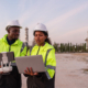 Engineer Specialists Pilot Drone on Construction Site