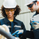 technician maintenance manager or Industrial engineer working and control robotic in heavy industry