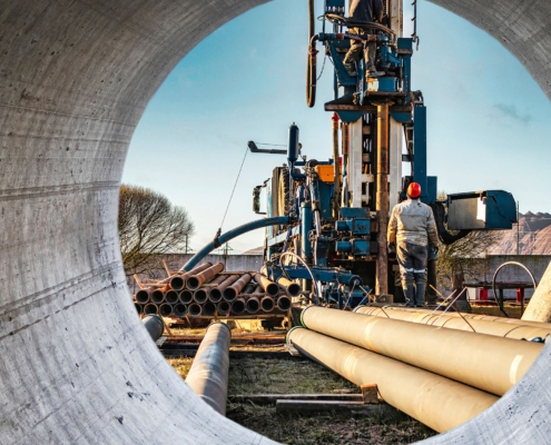 The drilling rig close-up is drilling a well against the background of the cloudy sky